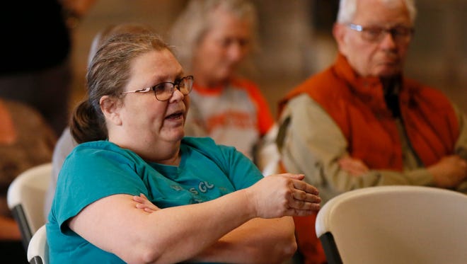 Pattye McAbee, of Carney, Okla., asks a question of Rep. Frank Lucas, R-Okla., during a town hall meeting in Chandler, Okla., on Feb. 22, 2017. McAbee said she had voted for Hillary Clinton and wanted Congress to leave Obamacare alone.