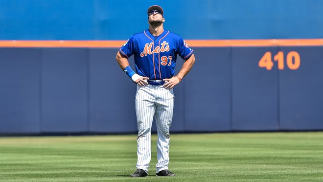 March 9: Tim Tebow , who starts in right field, prepares for his second Grapefruit League game.