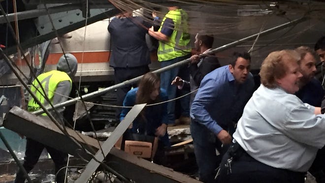 Passengers rush to safety after a N.J. Transit train crashed in to the platform at the Hoboken Terminal.