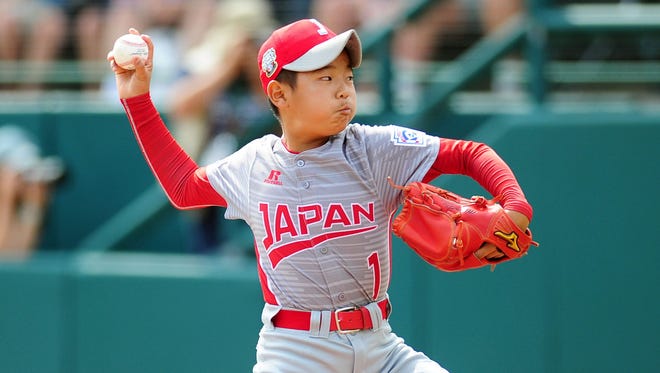 Japan pitcher Tsubasa Tomii delivers during the first inning against Texas.