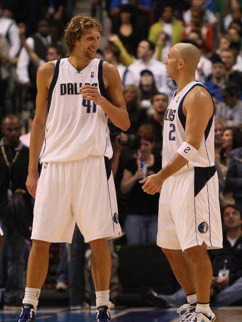 2009: Jason Kidd and Dirk Nowitzki talk after a timeout against the Sacramento Kings.