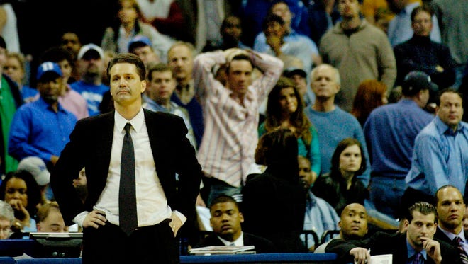 Memphis' head coach John Calipari watches the final minutes of a 53 - 44 loss to Louisville on Saturday, Feb. 26, 2005 in Memphis, Tenn.