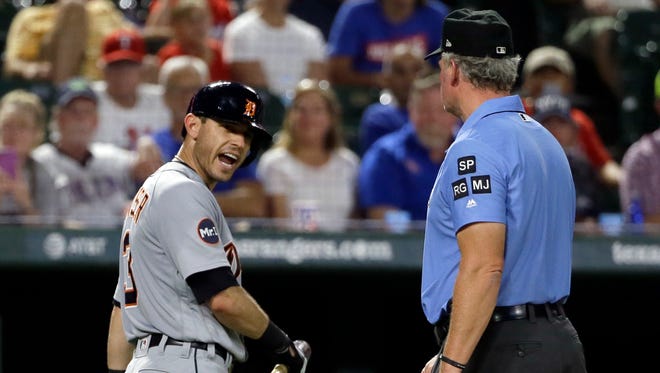 Tigers second baseman Ian Kinsler, left, argues with crew chief Ted Barrett, right, after Kinsler was ejected by home plate umpire Angel Hernandez in the fifth inning Aug. 14, 2017 in Arlington, Texas.