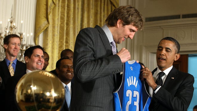 2012: President Barack Obama is given a jersey from Dirk Nowitzki.