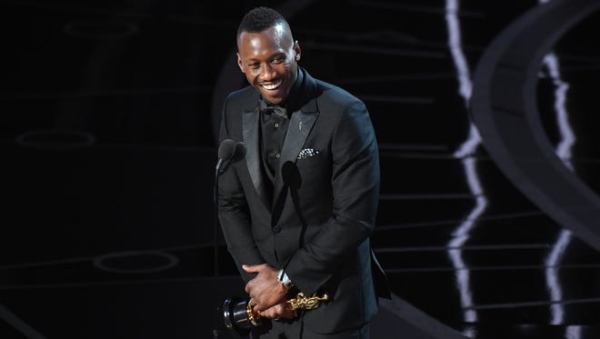 Mahershala Ali accepts the the Oscar for Best Supporting Actor for his role in 'Moonlight' during the 89th Academy Awards.