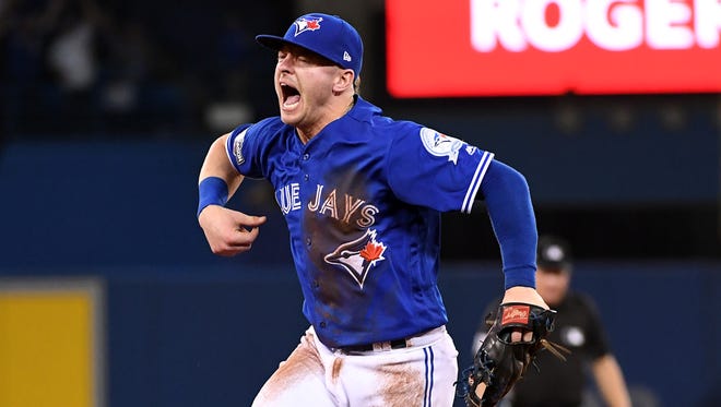 NLCS, Game 4: Blue Jays third baseman Josh Donaldson reacts after making a diving play and saving a potential run in the fifth inning against the Indians.