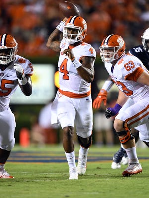 Clemson Tigers quarterback Deshaun Watson (4) scrambles out of the pocket looking to pass against the Auburn Tigers during the first quarter at Jordan Hare Stadium.
