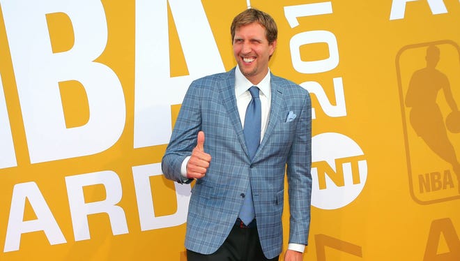 NBA player Dirk Nowitzki poses for photos on the red carpet before the 2017 NBA Awards.