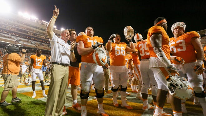 Tennessee Volunteers head coach Butch Jones celebrates with the team.