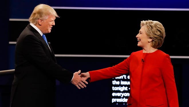Donald Trump and Hillary Clinton shake hands during the presidential debate at Hofstra University in Hempstead, N.Y., on Sept. 26, 2016.