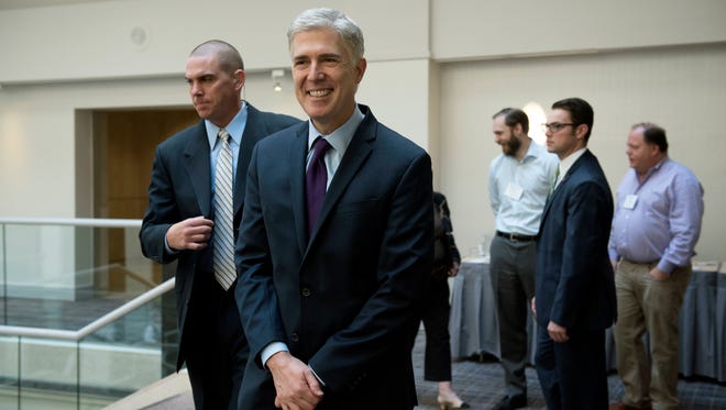Gorsuch leaves after attending a discussion about civility and professionalism in the practice of law at an American Inns of Court event in Washington on Oct. 21, 2017.