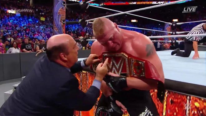 Brock Lesnar endured being thrown through two tables to retain his WWE Universal championship.