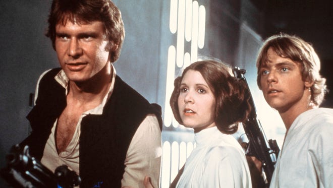 Of course his career has taken him to space! Harrison Ford, left, Carrie Fisher, and Mark Hamill are shown in a scene from the smash hit "Star Wars" in this 1977.