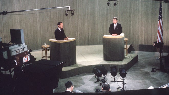 Nixon and Kennedy debate during a live broadcast from a New York television studio on Oct. 21, 1960.