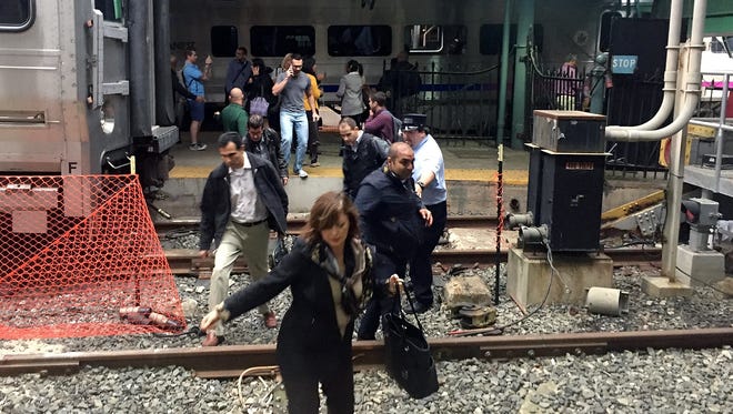Passengers rush to safety after a N.J. Transit train crashed in to the platform at the Hoboken Terminal on Sept. 29, 2016.