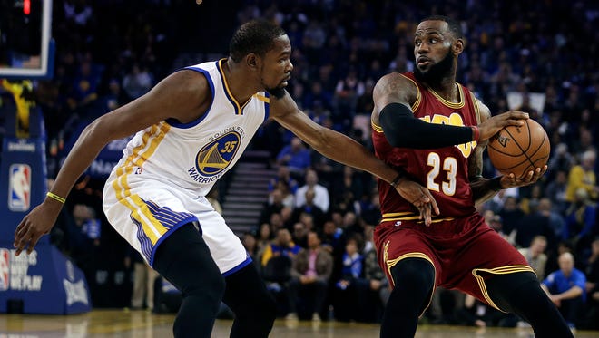 Kevin Durant defends against LeBron James during the first half.
