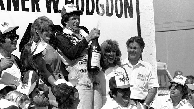 Darrell Waltrip, celebrating a victory in 1980, won three championships (1981, '82, '85). Waltrip hails from Franklin, Tenn.