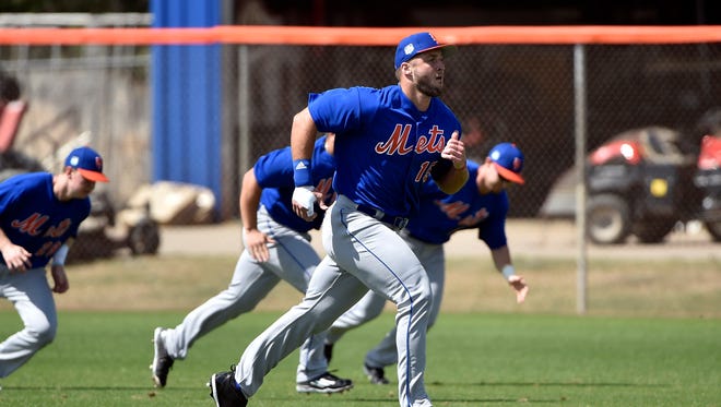 Feb. 27: Tim Tebow goes through running drills at  First Data Field in Port St. Lucie, Fla.