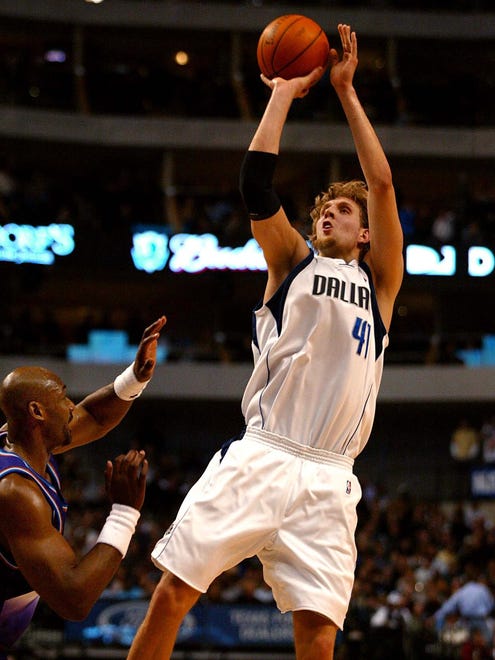 2002: Dirk Nowitzki shoots over Karl Malone of the Utah Jazz.