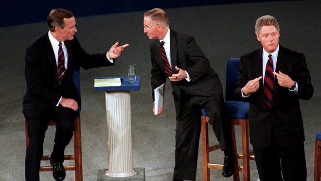 Bush, Perot and Clinton take part in their second debate in Richmond, Va., on Oct. 15, 1992.