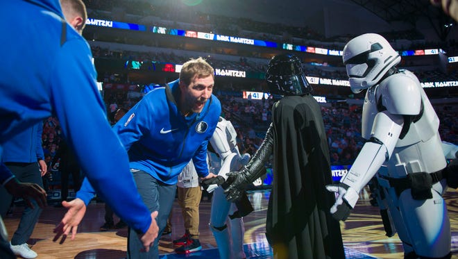 Dec. 2, 2017: Dirk Nowitzki  is introduced and runs past Darth Vader and a Stormtrooper before a game against the LA Clippers at the American Airlines Center.