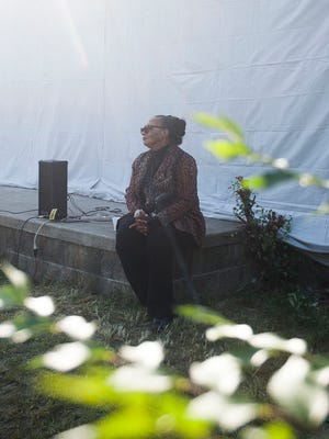 Rhea McCauley, family member of Rosa Parks, listens to a speaker at an event outside of Rosa Parks' old home in Detroit on Sunday, Sept. 25, 2016.