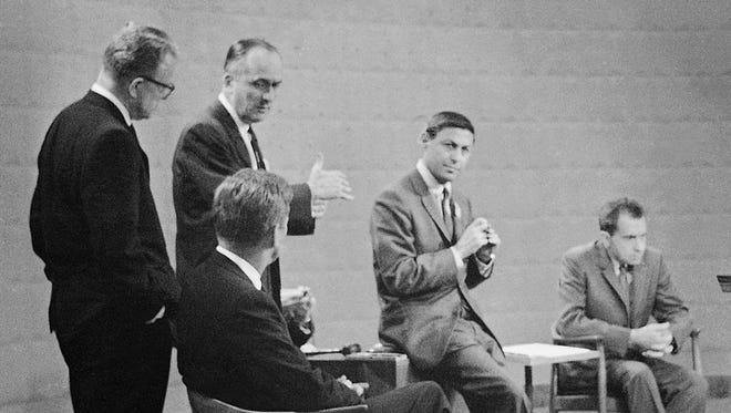 This was the scene in a Chicago television studio on Sept. 26, 1960, as a program director gives directions to John F. Kennedy, seated left, and Vice President Richard Nixon, right, before their debate. CBS' Don Hewitt is at center.