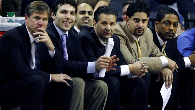 February 21, 2009 - Memphis coaching staff (left to right) John Robic - Assistant Coach, Josh Pastner - Assistant Coach, Bilal Batley - Asst. Director of Operations/Mgr., John Calipari - Head Coach, Orlando Antigua - Assistant Coach, and Rod Strickland - Director of Basketball Operations on the bench against SMU at the FedExForum.