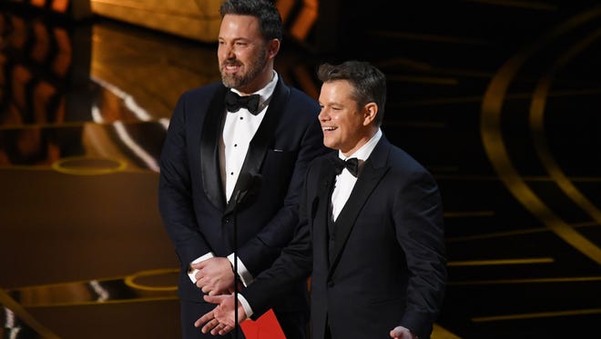 Ben Affleck, left, and Matt Damon present the award for Best Original screenplay during the 89th Academy Awards.