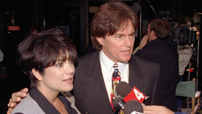 The Olympic gold medal champion and his wife Kris with the media at the Criminal Courts Building as they arrive for closing arguments in the O.J. Simpson double-murder trial in Los Angeles in 1995.