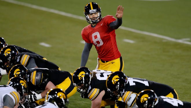 Iowa quarterback Tyler Wiegers calls a play at the line of scrimmage during the team's spring game.
