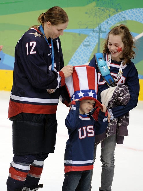 U.S. hockey player Jenny Potter with her children, son Cullen (middle), and daughter Madison.