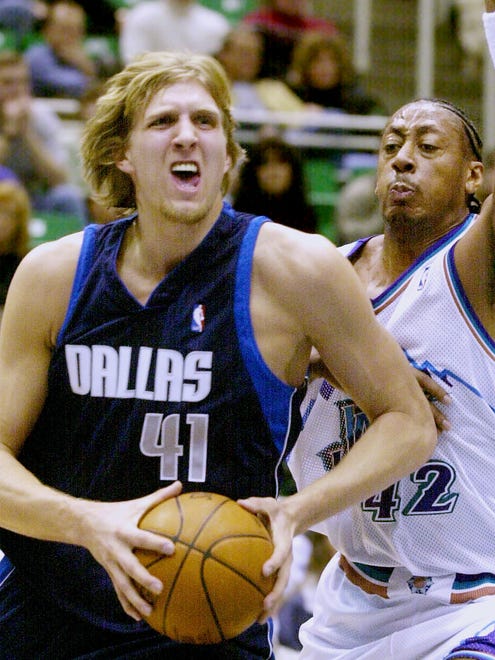 2001: Dirk Nowitzki works his way around Utah Jazz forward Donyell Marshall.
