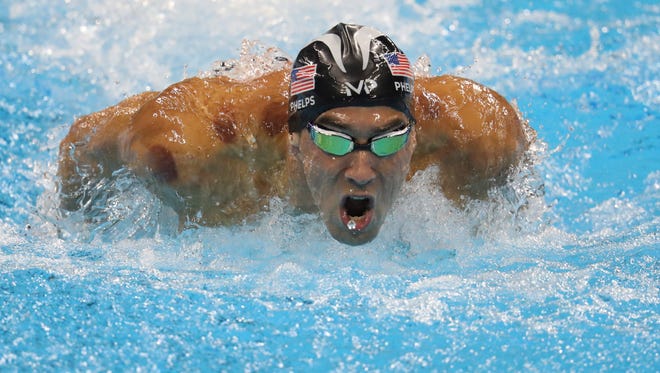 Michael Phelps swims during the evening men's 200 butterfly.