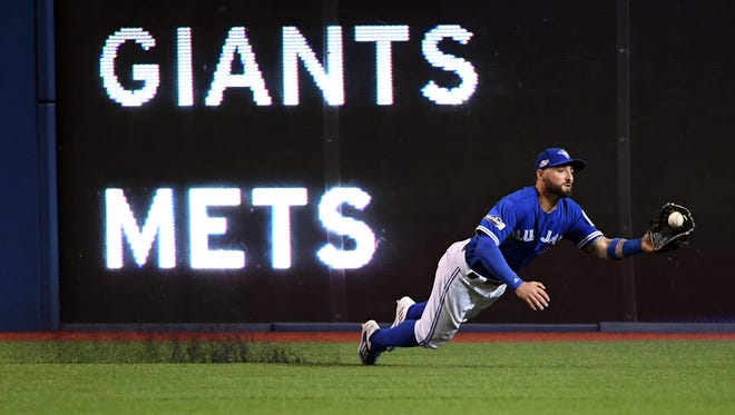 AL wild card game: Blue Jays center fielder Kevin Pillar makes a spectacular catch in the fourth inning to rob Manny Machado of a hit.