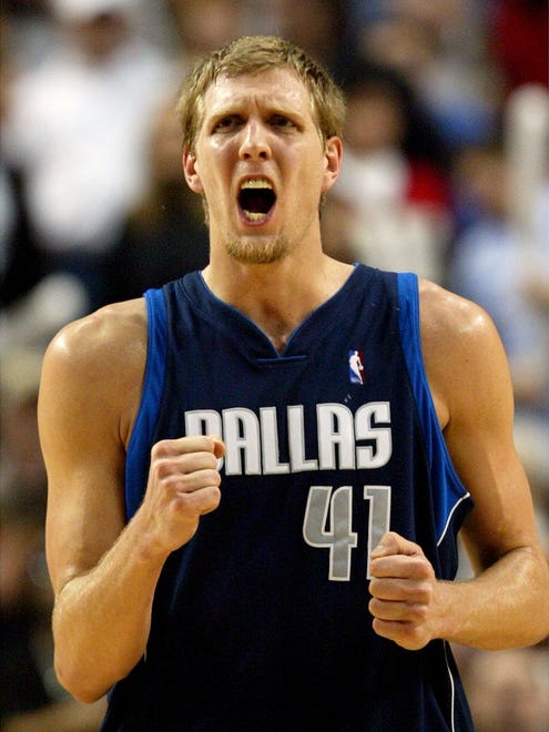 2004: Dirk Nowitzki shouts after sinking a basket in the final minute.