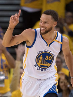 Golden State Warriors guard Stephen Curry celebrates against the Utah Jazz during the fourth quarter in Game 2 of the second round of the 2017 NBA Playoffs.