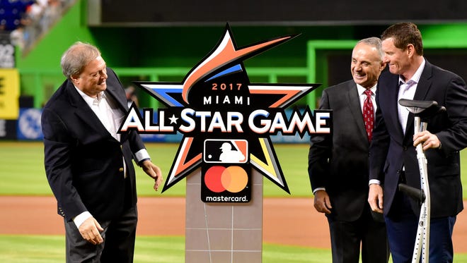 Marlins owner Jeffery Loria,  MLB commissioner Robert Manfred and former Marlins player Jeff Conine unveil the logo for the 2017 game.