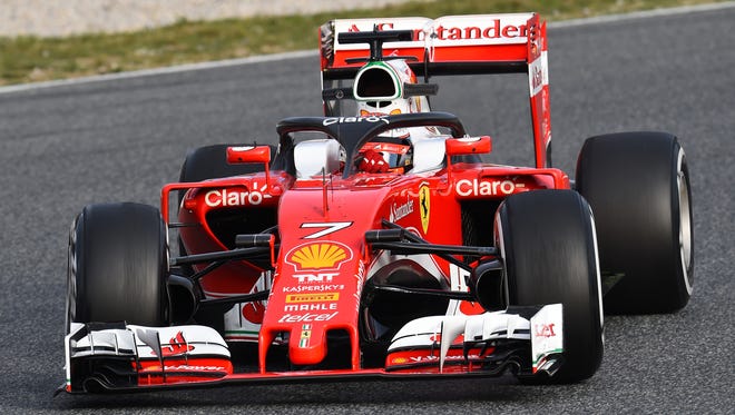 Kimi Raikkonen tests a halo head protection system in his Ferrari at Circuit de Catalunya in March 2016.