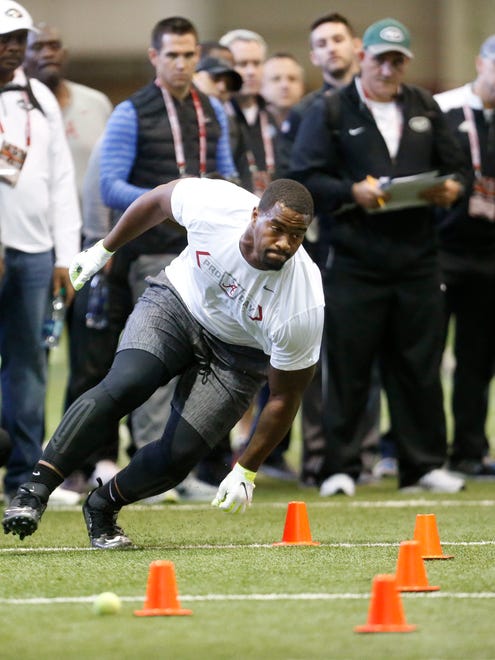 Former Alabama defensive lineman Jonathan Allen goes through an agility drill during Alabama's pro day, Wednesday, March 8, 2017, at the Hank Crisp Indoor Facility in Tuscaloosa, Ala.