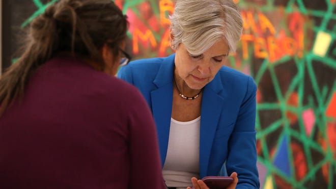 Stein works with an aide before the start of a campaign rally at the Hostos Center for the Arts & Culture on Oct. 12, 2016, in New York City.