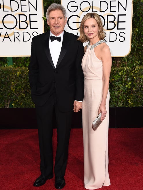 Harrison Ford and Calista Flockhart arrive at the Golden Globe Awards at the Beverly Hilton Hotel on Jan. 11, 2015.