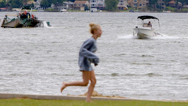 Muskego Police Officer Erin Cortese motors into the Idle Isle Park landing while on patrol on Little Muskego Lake on Aug. 16.