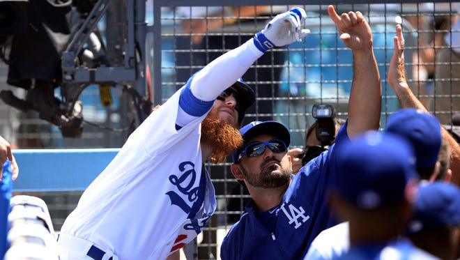 Aug. 13: Justin Turner  celebrates his 3-run homer with Adrian Gonzalez. It leads to the Dodgers -- who have played 19 straight series without a series loss and who have gone 28-5 since July 4 -- improve their MLB-best record to 83-34 and on pace for 115 wins, one shy of the MLB record.