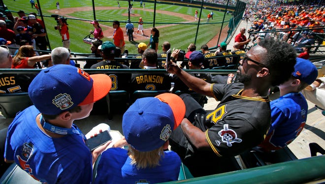 Grosse Pointe, Mich.'s players get in a selfie taken by Pittsburgh Pirates' Andrew McCutchen.
