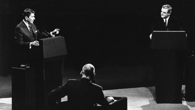 Reagan and Mondale debate in Kansas City, Mo., on Oct. 22, 1984. Pictured in the foreground is debate moderator Edwin Newman.