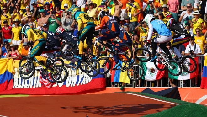 Riders catch some air over a jump during the men's BMX final.