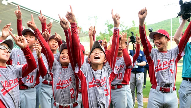 Ryuto Inoue (5) leads the celebration after Japan defeated Texas to win the Little League World Series in Williamsport, Pa.