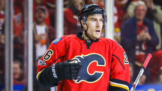 Defenseman Michael Stone. Re-signed with the Flames at three years, $10.5 million.