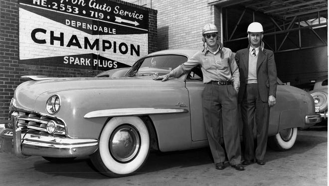 Red Byron, left, posing with Raymond Parks in front on Byron's Auto Shop in Atlanta in 1950, won NASCAR's first championship in 1949. Byron hailed from Anniston, Ala.
